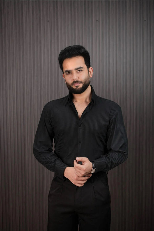 Men styling black slim fit pinstripe shirt with dress pants